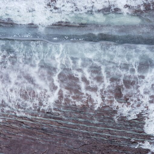 water waves hitting on brown wooden surface